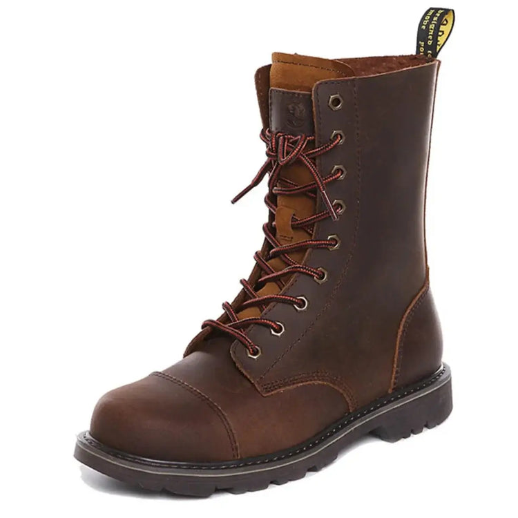Brown leather lace-up hiking boot featuring smooth leather upper, contrasting toe cap, red laces, metal eyelets, visible stitching, yellow pull tab, and thick sole.