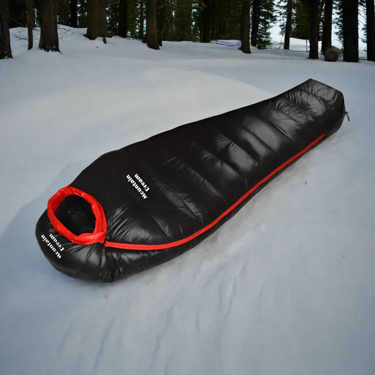 "Black Mountain Dream sleeping bag on snow."