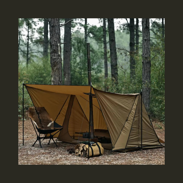 Backpacking hot tent set up in the forest with a stove jack and a camping chair.