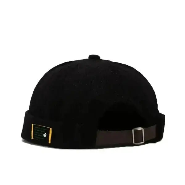 Black corduroy brimless cap with adjustable strap, perfect for men and women seeking style and comfort in a brimless baseball hat.