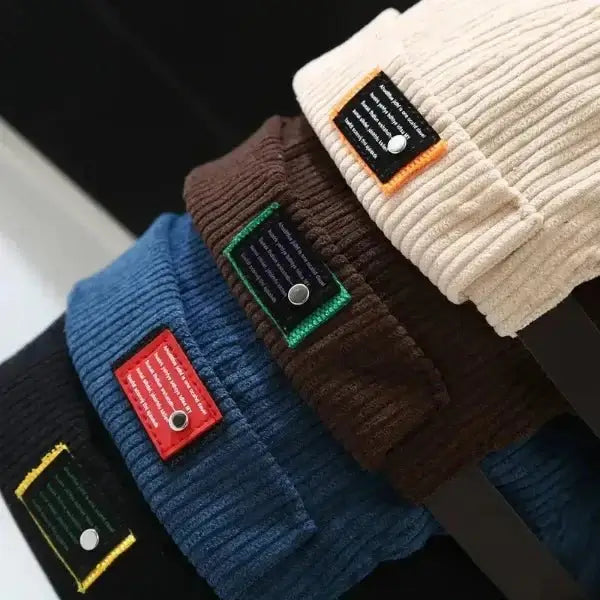 Assorted colors of high-quality corduroy brimless hats, featuring built-in fold and go functionality for easy storage and portability.