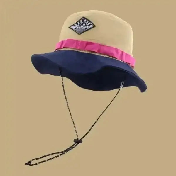 Stylish two-toned bucket hat with wide brim and adjustable chin strap for sun protection, perfect for outdoor activities in spring and summer.