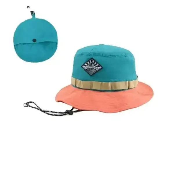 Teal and coral wide brim bucket hat with packable design and a strap, perfect for sun protection and outdoor activities