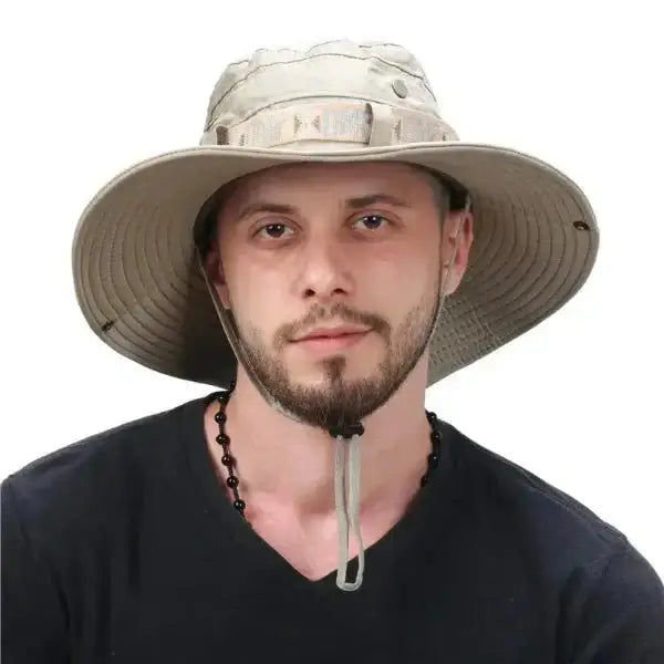 Man wearing a beige wide-brim bucket hat for men, perfect for hiking, fishing, outdoor sports, and sun protection.