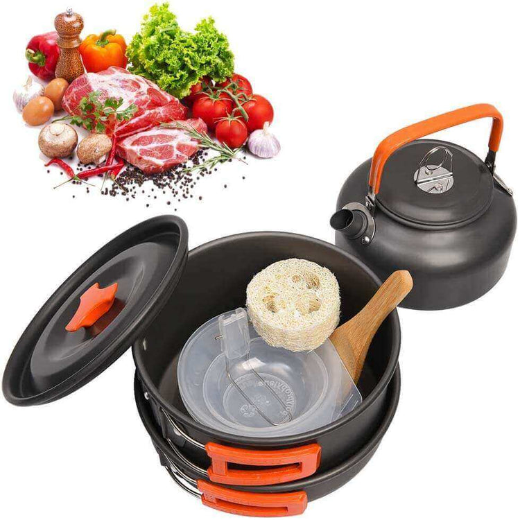 Non stick camping cookware set with pots, pans, kettle, and fresh ingredients for healthy cooking.