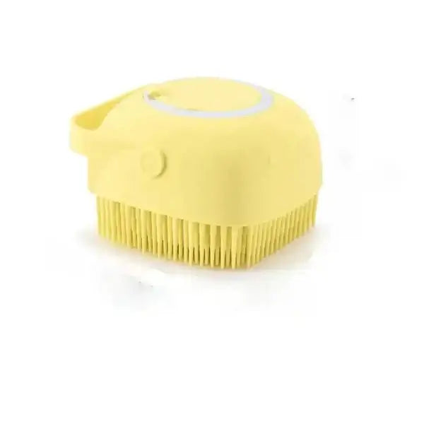 Yellow silicone dog grooming brush with built-in shampoo dispenser for easy pet bathing and grooming