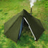 Tipi pyramid hot tent with stove jack for solo camping in winter, ultralight and waterproof on grassy ground.