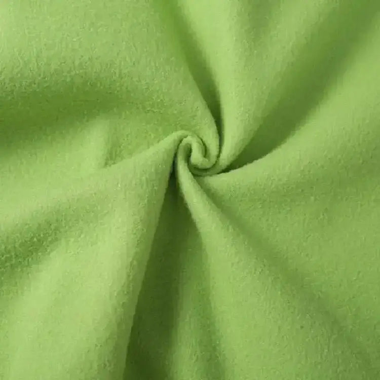 Close-up of soft green polyester fabric with a cozy texture, perfect for Women&