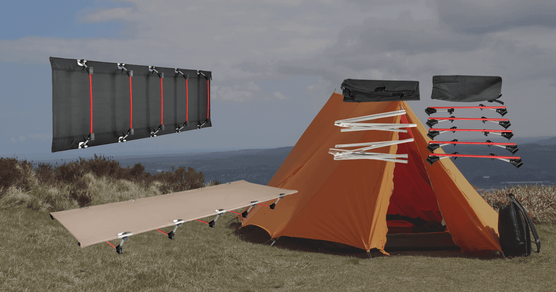 Camp folding bed setup alongside an orange tent in a scenic outdoor location.