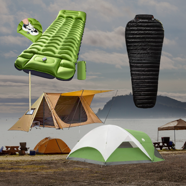 "Camping gear including tents, an air mattress, and a sleeping bag set up on a lakeside site under a cloudy sky."