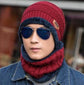 Man wearing a red wool fisherman beanie and matching scarf, styled with sunglasses and a denim jacket.