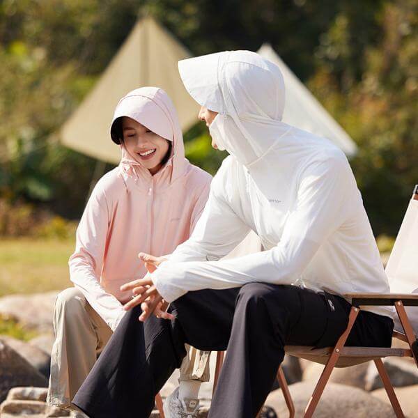 Unisex sun protective hooded jackets in pink and white, perfect for summer, providing UPF 50+ protection, ideal for outdoor activities.