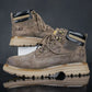 Pair of gray suede Caterpillar Martin lightweight waterproof hiking boots with lace-up closure, dark brown trim, light rubber sole, and &