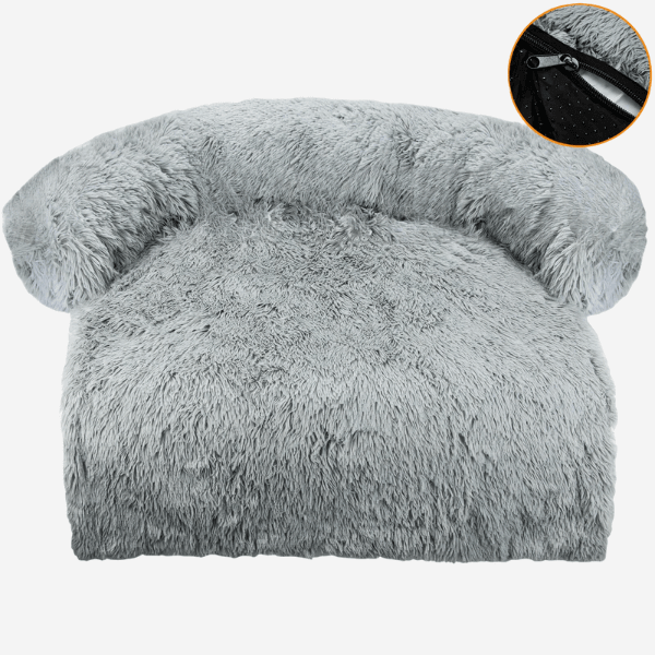 Gray dog bed with arched backrest, white background.