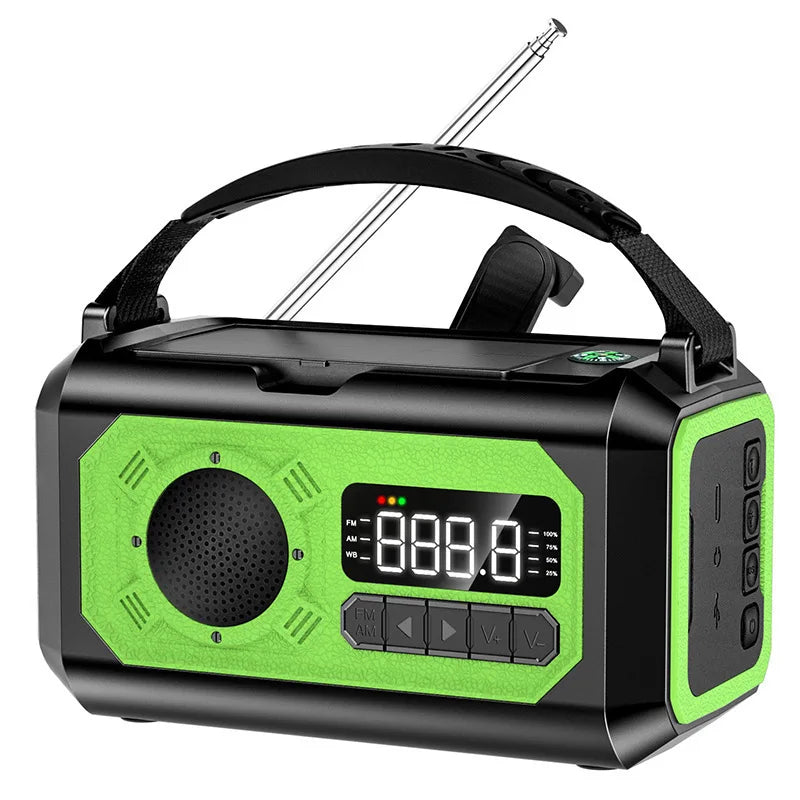 Green radio with antenna, solar, electric, and hand crank charging, holding strap, white background.