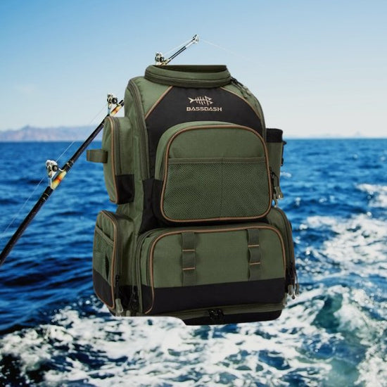 Waterproof fishing tackle backpack with protective rain cover, multiple compartments, and impact-resistant base, ideal for fishing gear.