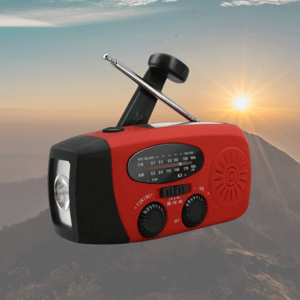 red Hand crank radio with antenna, power bank, flashlight, solar charging, white background, charging mobile.