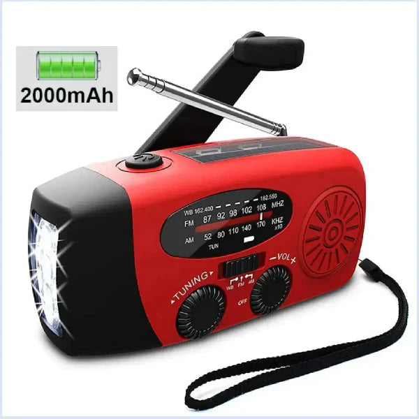 Emergency red solar crank radio, portable power bank, white background.