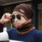 Man wearing brown wool slouch beanie and matching neck warmer, showcasing stylish winter fashion.