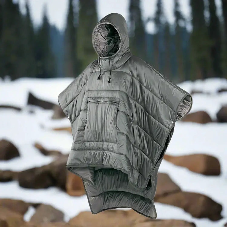 Wearable poncho sleeping bag in a natural outdoor setting, showcasing multifunctional comfort and premium design.