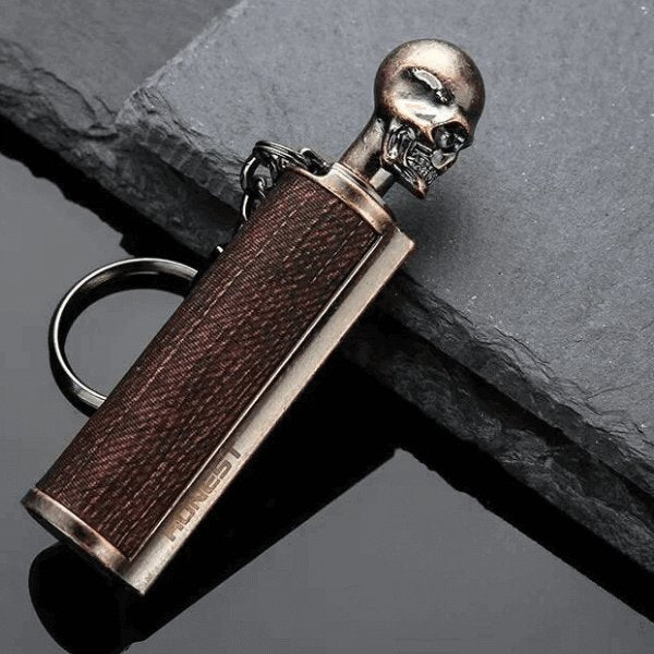 Portable immortal match stick lighter keychain with a skull design, perfect for camping and outdoor activities.