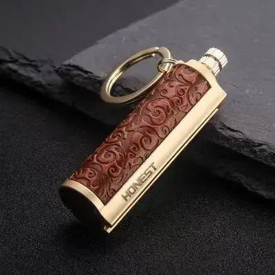 Portable Immortal Match Stick Lighter for camping, hiking, and outdoor activities, featuring a detailed alloy design and keychain for easy carrying.