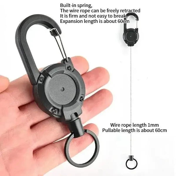 Heavy-duty retractable keychain with 60cm extendable wire, built-in spring, durable metal clip, shown in hand for size comparison.