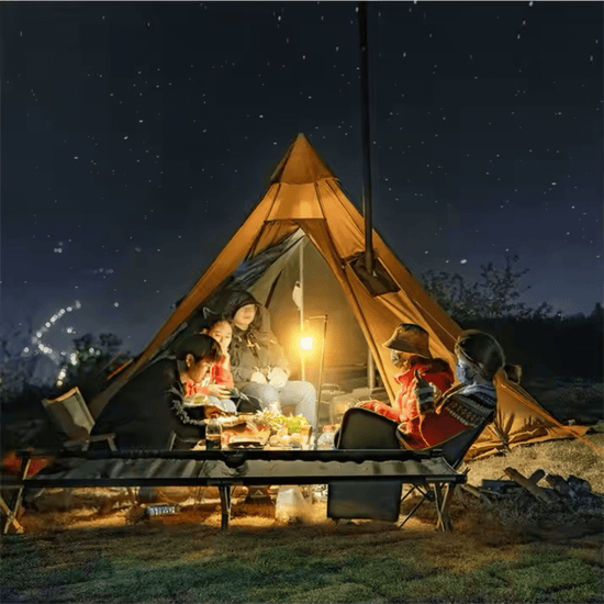 Group camping around a hot tipi tent under a starry night, enjoying warmth and light from a stove, ideal for 2-4 people.