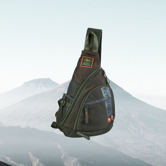 Durable and versatile black and green travel crossbody sling bag for men, perfect for school trips, travel, and everyday errands.
