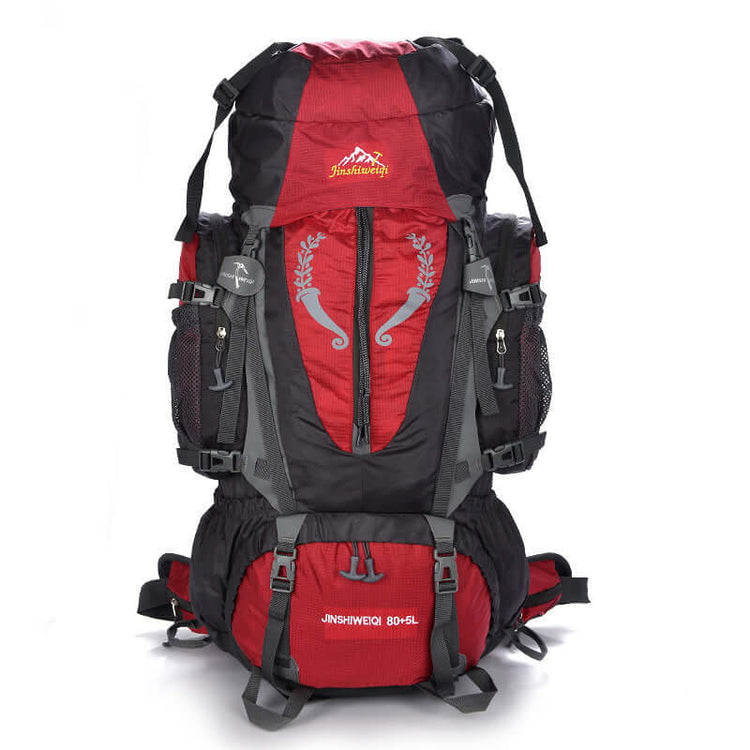 Large red hiking backpack with multiple compartments, suitable for travel, equipped with waist and luggage straps, 55-75L capacity.