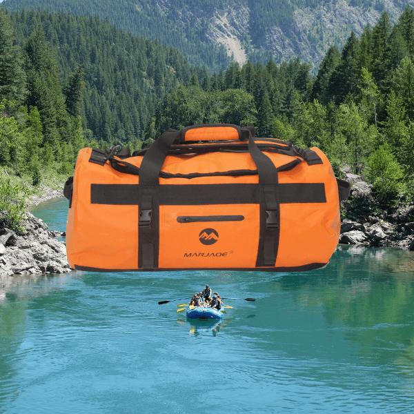 Orange waterproof duffel bag by Marjaqe on a river background, ideal for outdoor adventures and water-resistant travel.