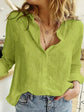 Women wearing green button-up cotton linen shirt top with a relaxed fit and V-neck design, paired with denim jeans.