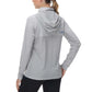 Woman wearing Women’s UPF 50+ Performance Hoodie showing back view in grey, long-sleeved lightweight pullover for outdoor activities.